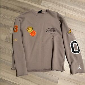 Jordan Brown Sweatshirt with Orange and Yellow Accents